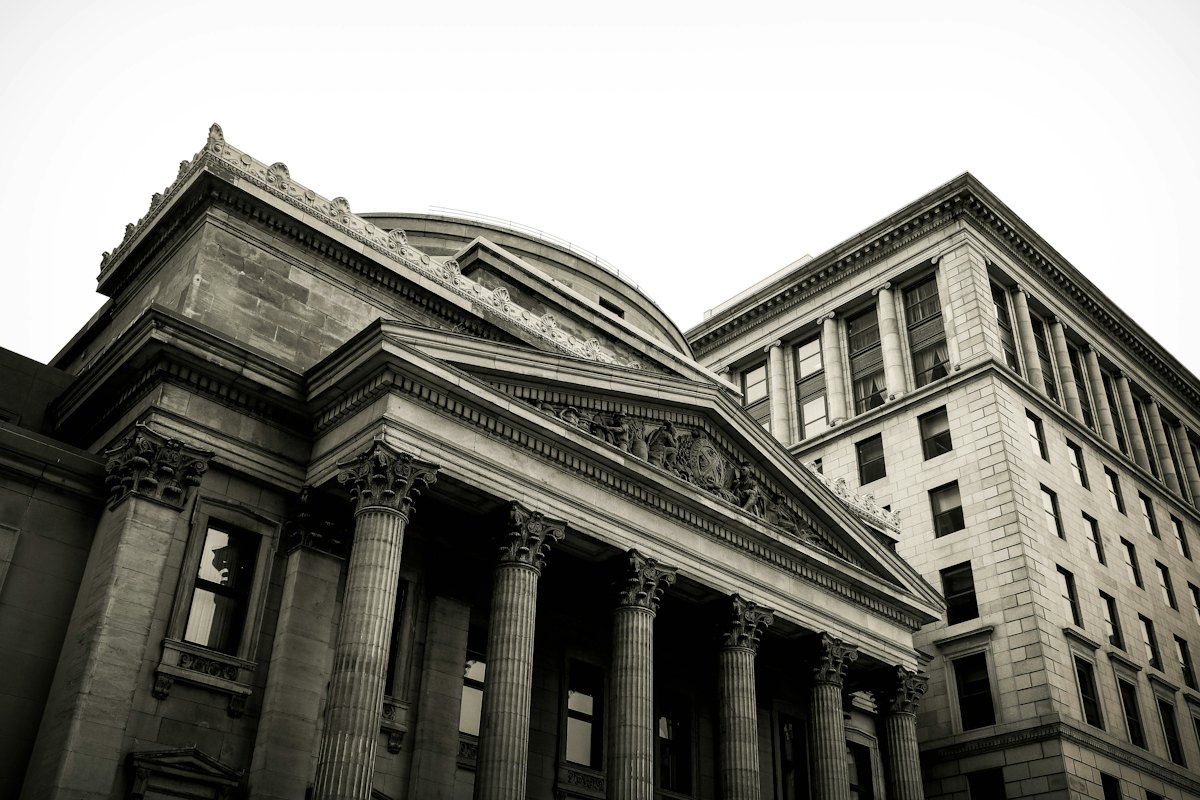 Classical government-style stone buildings with columns and domes.